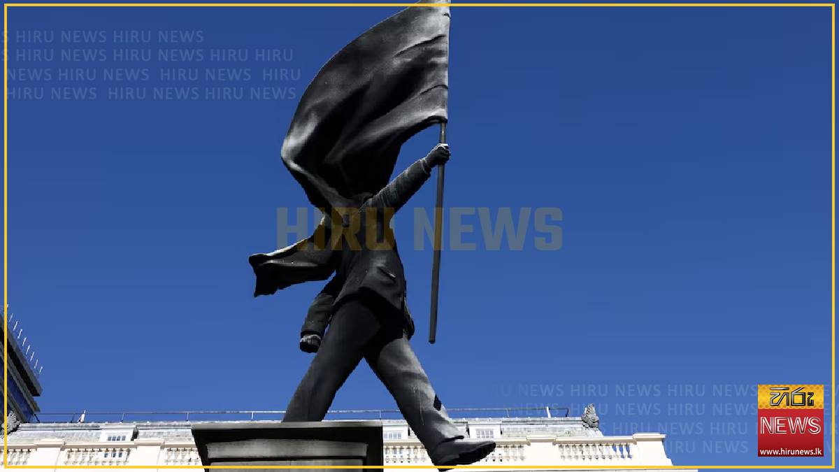 Banksy installs statue of flag-wielding man in central London