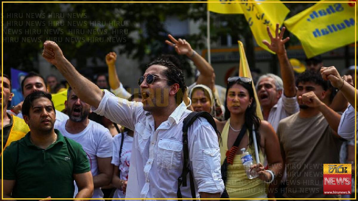 Paris police arrest 20 as demonstrators defy ban on Iran opposition rally