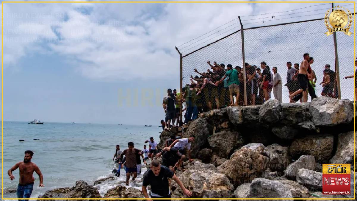 Spain’s enclave Ceuta raises alarm as thousands cross border from Morocco