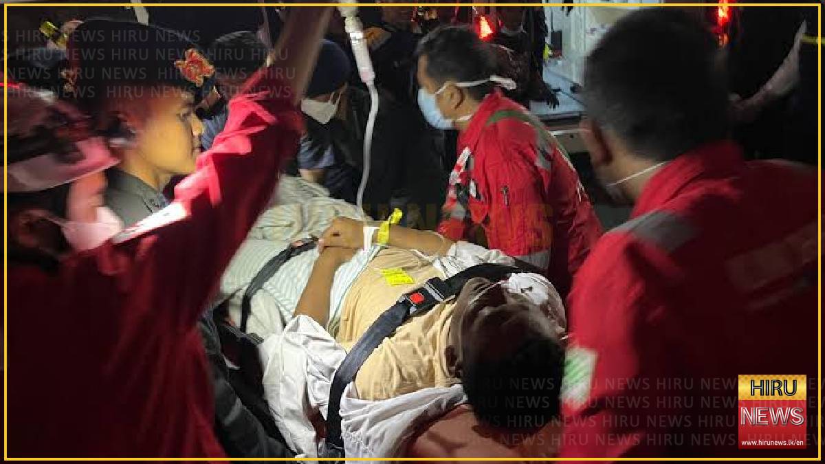 Indonesia rescuers battle turbulent seas in search for 129 people after passenger ship capsizes