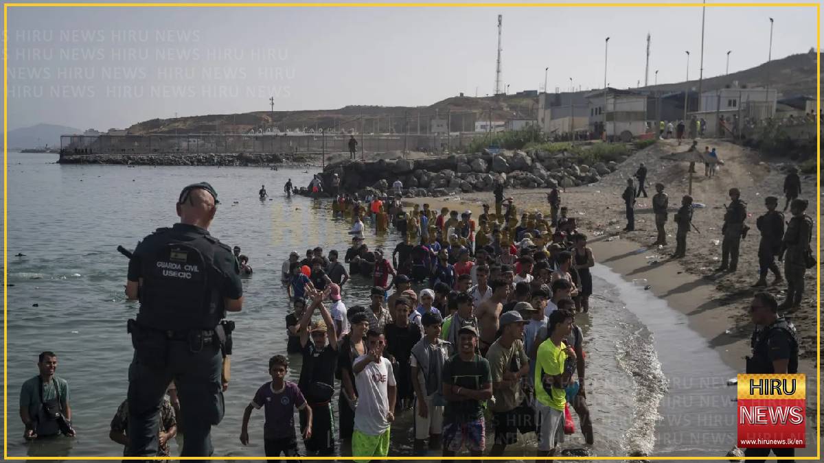 Spanish police launch operation to clear Ceuta migrants off beach