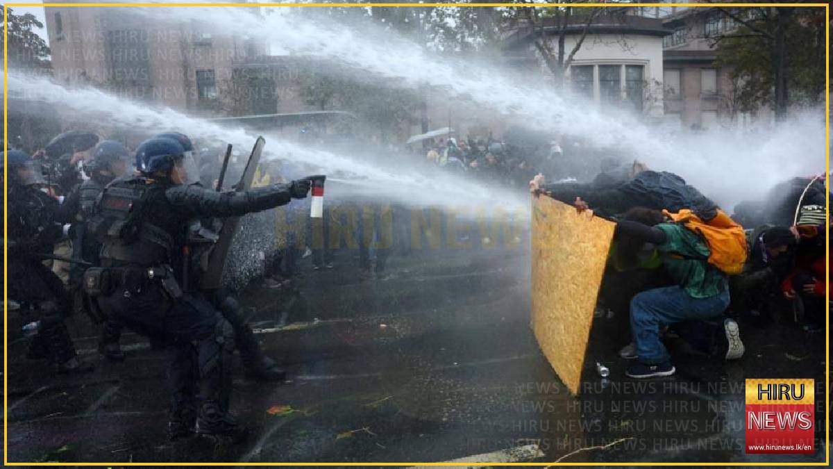 Clashes erupt in Paris after largely peaceful protests across France